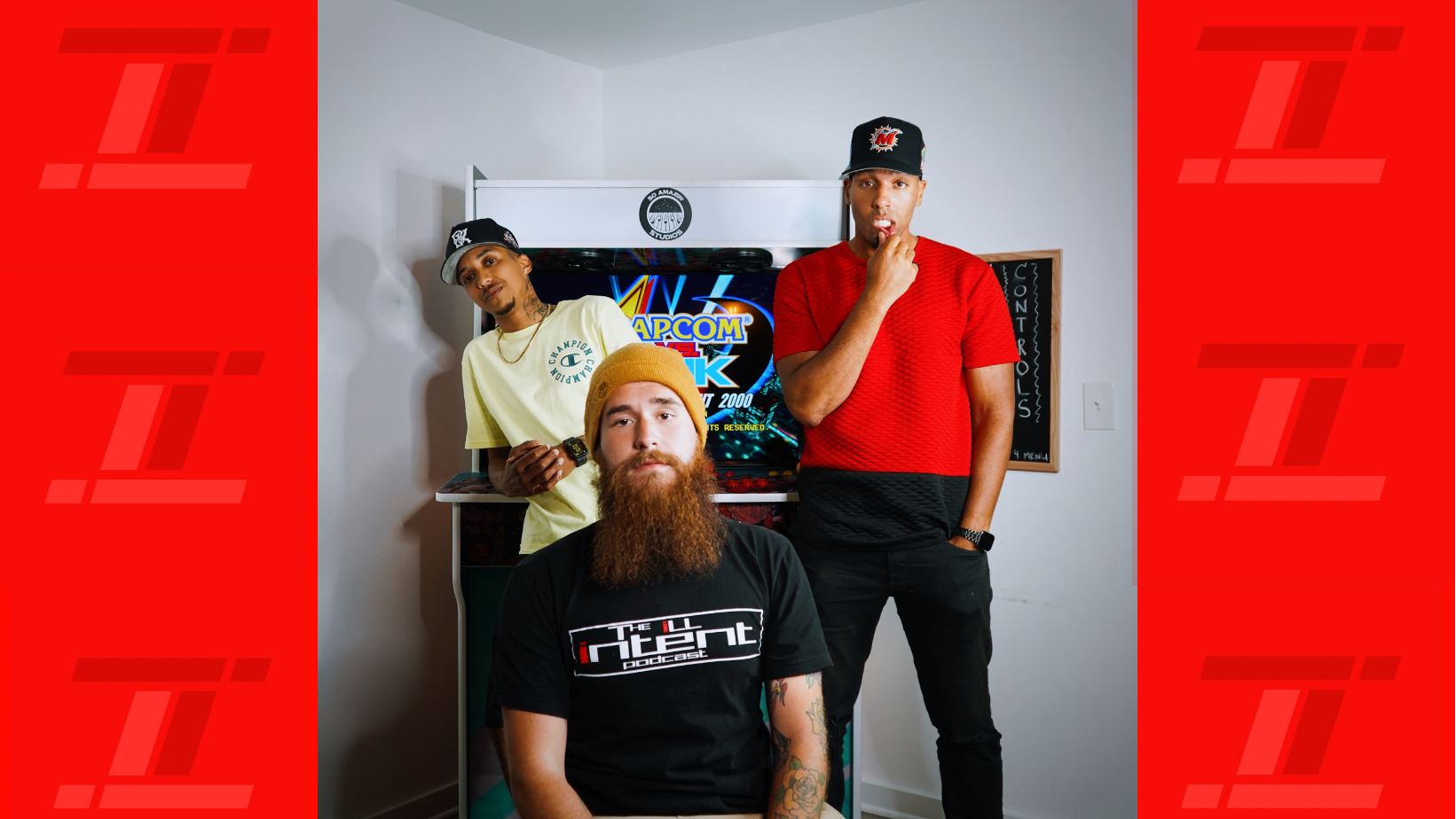 Ill Intent Podcast team pictured beside an arcade cabinet